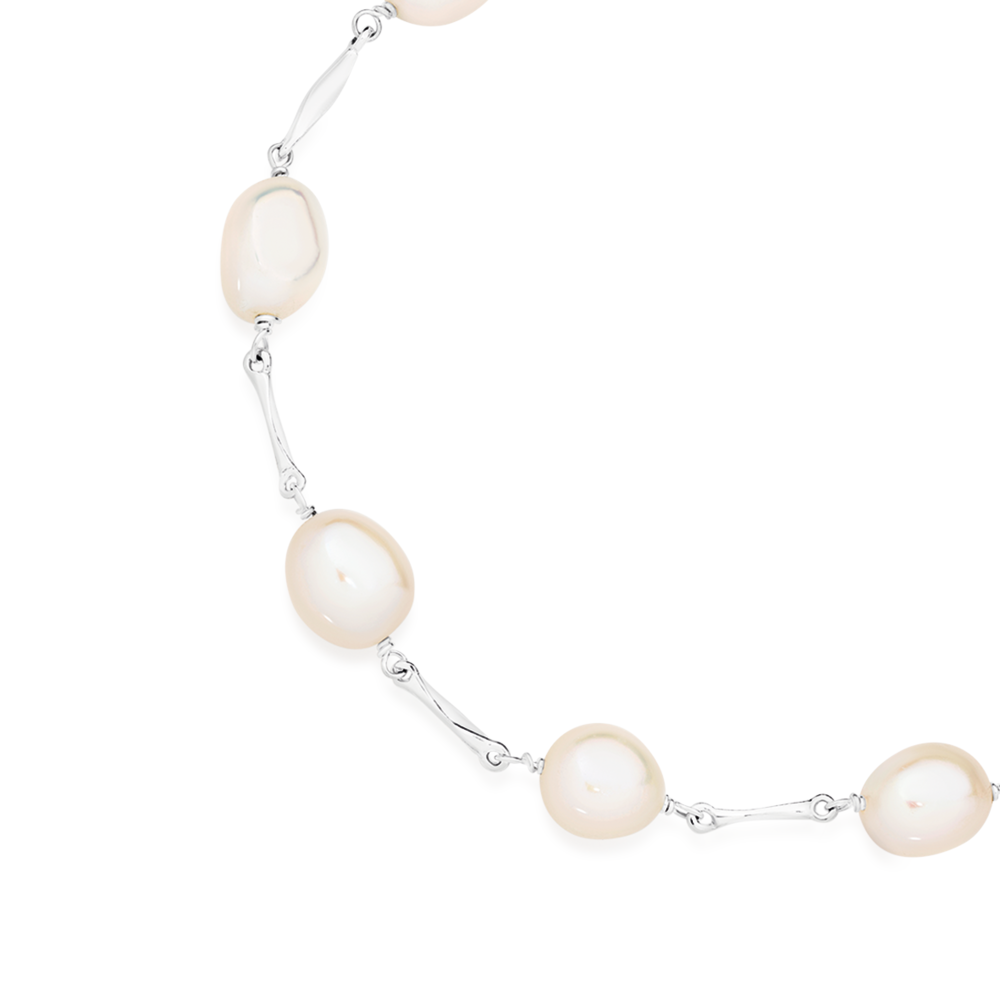 Elegant White Freshwater Oval Shape Pearl Necklace – Mangatrai Gems &  Jewels Pvt Ltd